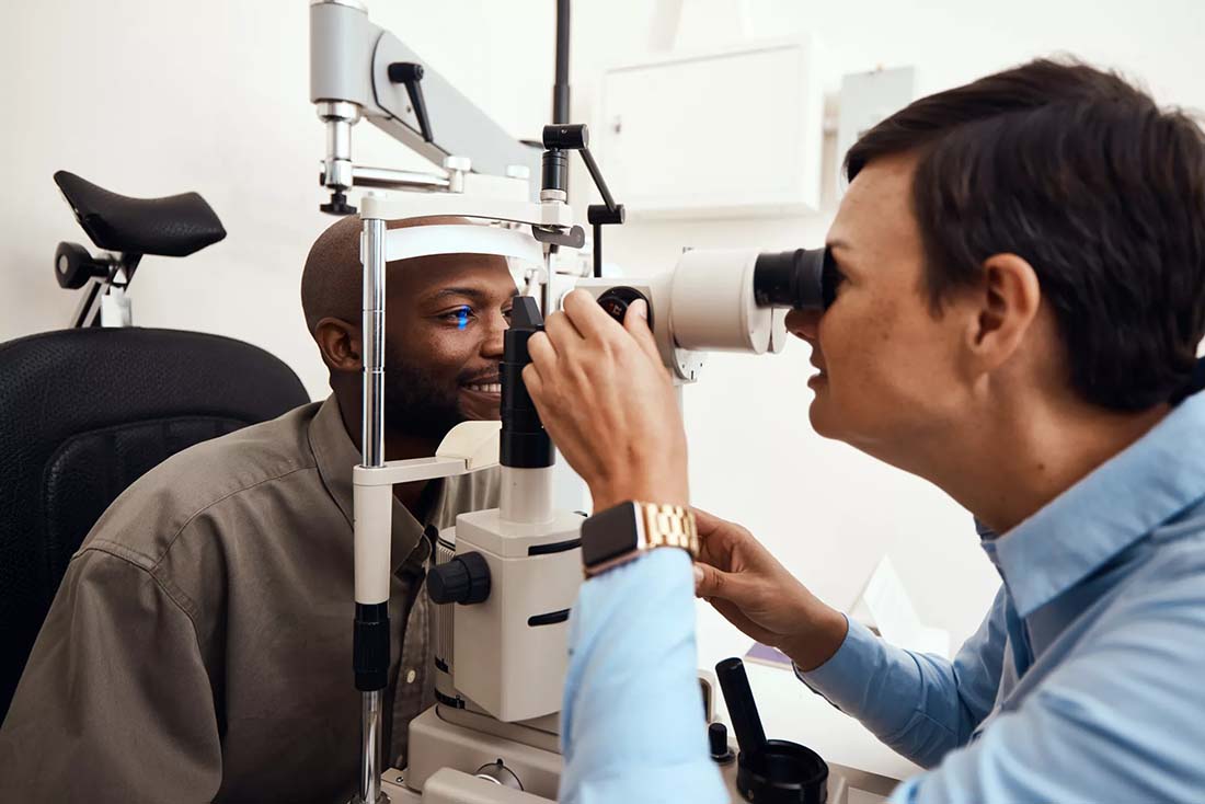 Doctor examining patients eyes